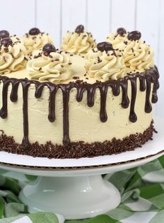 a cake with chocolate and cream icing drizzled on top