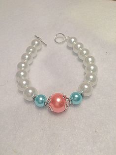 A personal favorite from my Etsy shop https://www.etsy.com/listing/580818639/bridesmaid-beaded-bracelet-aqua-orange Adjustable White Bracelets For Mother Of The Bride, Adjustable 8mm Beads Bracelets For Wedding, White 8mm Beads Bracelets For Wedding, White Round Beads Jewelry For Bridesmaid Gift, White Beaded Jewelry For Bridesmaid Gift, Pearl Beaded Bracelets With Round Beads For Bridesmaid Gift, Pearl Beaded Bracelets For Bridesmaid Gift With Round Beads, Handmade Rosary Bracelet With Round Beads For Wedding, Pearl White Adjustable Beaded Bracelets For Bridesmaids