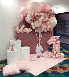 a room with balloons and decorations on the floor