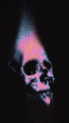 an image of a skull in the dark with pink and blue light coming from it