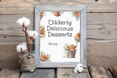 there is a sign that says uddery delicious desserts with cotton in front of it