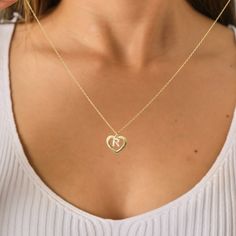 Introducing our enchanting Personalized Initial Heart Necklace 💖✨ Embrace the beauty of individuality with our exquisite Personalized Initial Heart Necklace - a perfect blend of elegance and personal touch! 💖 Cherished Customization: Make a statement with this heartwarming necklace by adding your or a loved one's initial. This personalized touch transforms the piece into a unique and meaningful accessory that captures the essence of your identity or a special connection. ✨ Timeless Elegance: Crafted with precision and attention to detail, the delicate heart pendant exudes timeless elegance. The dainty design makes it a versatile accessory that seamlessly transitions from day to night, adding a touch of sophistication to any outfit. 💖 Quality Craftsmanship: Our artisans meticulously crea Personalized Open Heart Jewelry With Initials, Double Heart Necklace With Initials For Mother's Day, Double Heart Initials Necklace For Mother's Day, Double Heart Initials Necklace For Valentine's Day, Open Heart Birthstone Charm Necklace, Silver Heart Necklace With Initials, Engraved Double Heart Necklace For Her, Valentine's Day Double Heart Necklace With Initials, Valentine's Day Double Heart Initials Jewelry