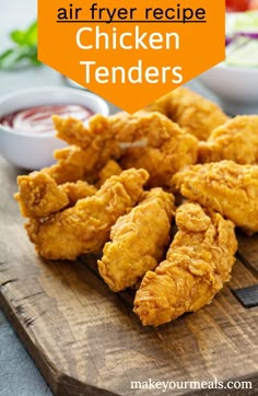 fried chicken tenders on a wooden cutting board with dipping sauce in the background and text overlay that reads air fryer recipe chicken tenders