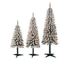 three white christmas trees with snow on them