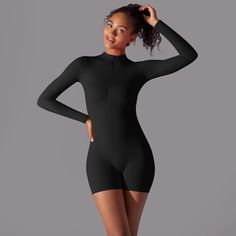 The B|Fit CONTOUR Unitard is the ultimate gym companion. With its sleek design and comfortable fit, this unitard offers both style and performance. Move freely and confidently through your workout, knowing this unitard has you covered. Perfect for any fitness enthusiast. Fitted Breathable Bodysuit For Yoga, High Stretch Moisture-wicking Bodysuit For Pilates, High Stretch Moisture-wicking Unitard For Yoga, Compression Unitard For Yoga, Compression Sportswear Unitard For Yoga, Solid Unitard With Thumbholes For Dancewear, Athleisure Yoga Unitard With Thumbholes, Solid Dancewear Unitard With Thumbholes, Solid Color Dancewear Unitard With Thumbholes