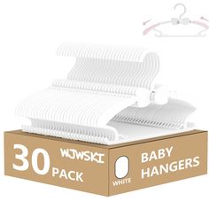 the baby hangers are white in color and have been placed on top of each other