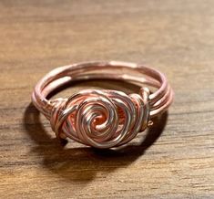 Handmade spiral rose ring. Each ring is handmade by me and there may be slight variations in each ring. Available in silver, gold and rose gold colors. ______________________________________________________________ The plated colors (silver, gold, rose gold) are copper or brass based. Some people Wire Rose Ring, Music Note Ring, Wire Rose, Diy Jewlery, Wire Ring, Rose Ring, Jewelry Wire, Wire Rings, Ring Rose Gold