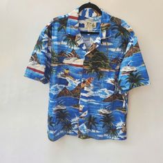 Mint Vintage! Made In Hawaii! Euc Vintage Shirt. Button Down And Collar. Hawaii Coastal Scene With A Surfer, Volcano, And A Cruise Liner; On Front, Back And On Sleeves. Matching Open Chest Pocket With The Print = True Hawaiian Vintage. Polished Coconut Buttons, Made In Hawaii. Y2k. See Measurements, This Is A Men's Shirt, But It Is Unisex! Mint Vintage Condition! Nwot Size Xl 100% Cotton Aprox.Meas. Flat Lay Unstretched Pit To Pit: 26" Length: 29"-30" Condition: Nwot Vacation Tops With Buttons And Camp Collar, Hawaiian Vacation Tops With Button Closure, Hawaiian Vacation Tops With Buttons, Blue Button-down Shirt For Vacation, Hawaiian Shirt With Buttons For Vacation, Hawaiian Button-up Top For Vacation, Blue Hawaiian Shirt With Button Closure For Summer, Blue Hawaiian Shirt For Summer, Summer Tops With Buttons And Camp Collar