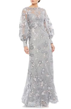 Beautifully embroidered flowers and sparkling embellishments dazzle the sheer top layer of an elegant A-line gown with voluminous balloon sleeves. 61" length Back zip closure Bateau neck Long sleeves Lined 100% polyester Spot clean Imported Asian Owned/Founded Floral Evening Dresses, Sleeve Gown, Full Length Skirts, Long Sleeve Gown, Column Gown, Floor Length Skirt, Mac Duggal, Bishop Sleeve, A Line Gown