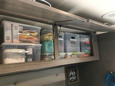 the shelves are filled with plastic containers and bins for food storage in an rv