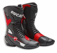 a pair of black and red motorcycle boots