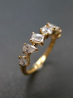 three stone diamond ring in yellow gold