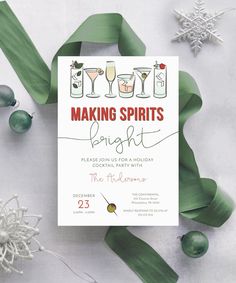 a white card with the words making spirits bright on it, surrounded by christmas ornaments