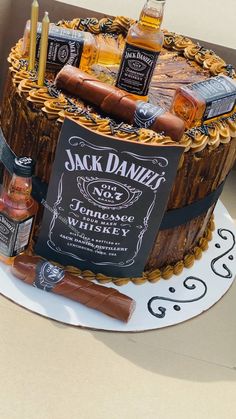 a birthday cake with liquor and cigars on it