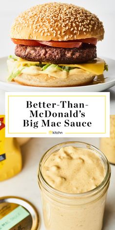 a hamburger with cheese and lettuce next to a jar of sauce