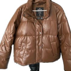 Faux Leather Outerwear For Cold Weather In Fall, Trendy Leather Outerwear For Cold Weather, Faux Leather Outerwear For Winter, Leather Outerwear For Cold Weather, Faux Leather Outerwear For Cold Winter Weather, Leather Outerwear For Outdoor, Fall Puffer Leather Jacket For Work, Leather Puffer Jacket With Zipper For Fall, Fall Leather Jacket With Padded Collar