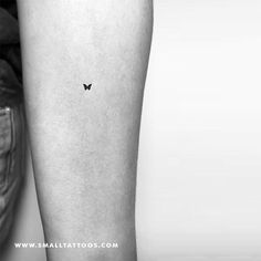 a black and white photo of a butterfly tattoo on the right leg, by small tattoos