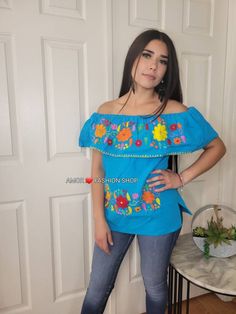 "Have a Touch of Color with this one of a kind made with LOVE Mexican Hand Embroidered Style Top. It fits comfortably and can be used casually with your favorite jeans or dress it up with a jacket and pumps. Must know: Each piece is made with Love (Handcrafted) and there could be a difference in pattern and colors from the profile picture. Fabric is comfortable cotton known as manta. Washing instructions: Handwash (preferable) Use delicate cycle Air dry Sizes: Onesize (Unitalla) Bust 38-40\" Len Handmade Blue Tops For Festival, Blue Bohemian Embroidered Top, Handmade Bohemian Blue Tops, Handmade Blue Bohemian Tops, Bohemian Cotton Tops With Machine Embroidery, Bohemian Embroidered Peasant Top For Festival, Blue Bohemian Embroidered Peasant Top, Blue Embroidered Folk Peasant Top, Bohemian Blue Embroidered Top With Geometric Patterns