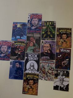 a bunch of comics are hanging on the wall