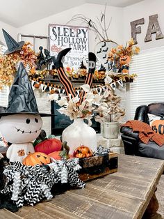 a table with pumpkins and decorations on it