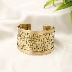 Wide Minimalist Braided Brass Cuff Bracelet, Stunning Piece Made From Brass, This Cuff Bracelet Features Intricate Iintertwining Inspired by Ethnic Motifs, It Will Add a Boho Touch to Any Outfit. Its Meticulously Design With Intertwined  Patterns Makes this Bracelet a Remarkable Accessory That Attracts Attention.  Its Adjustable Design Ensures a Comfortable Fit For All Wrist Sizes, Making It a Versatile Accessory For All Occasions. -Material: Brass -Color: Silvered or Golden -Diameter 6cm But Ad Bohemian Metal Cuff Bracelets, Bohemian Metal Braided Bangle Bracelets, Bohemian Metal Braided Bangle Bracelet, Bronze Bohemian Cuff Bracelet, Bohemian Metal Bangle Cuff Bracelet, Bohemian Metal Cuff Bangle, Bohemian Metal Jubilee Bangle, Bohemian Jubilee Bangle, Brass Cuff Bracelet