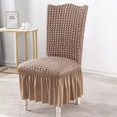 a chair with a ruffled seat cover on it