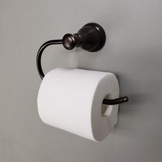 a roll of toilet paper is hanging on the wall