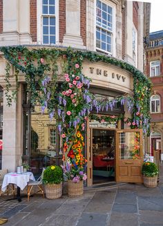 the ivy is growing on the building's front door and it looks like it has been decorated with flowers