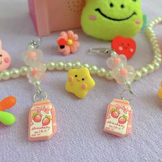 Complete your adorable outfits with these beautiful strawberry milk earrings! These cute earrings are perfect for a picnic date, or a school day, ...they even are the perfect birthday gift. So please don't wait and get them now! <3 Drop length: 6cm  What's included in your purchase? One pair of Strawberry milk earrings, and some freebies :) Please note: Every pair of earrings is handmade. Products may differ slightly in shape, color, and design.  Visit our shop for more kawaii jewelry and digital products: https://www.etsy.com/shop/dearlatibuleshop/?etsrc=sdt If you need any help with your order, please let me know! Enjoy your purchase! Milk Earrings, Strawberry Fairy, Kawaii Flowers, Earrings Strawberry, Milk Fruit, Stargirl Aesthetic, Bright Aesthetic, Cottagecore Earrings, Kawaii Outfits