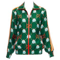 GUCCI 2023 Pikarar GG logo monogram green orange silk track jacket XXS Reference: AAWC/A00706 Brand: Gucci Designer: Alessandro Michele Collection: Pikarar Material: Silk Color: Green, Orange Pattern: Monogram Closure: Zip Lining: Green Silk Extra Details: Orange webbing at sides. Made in: Italy CONDITION: Condition: Excellent, this item was pre-owned and is in excellent condition. This piece appears to be unworn and is in great condition. Comes with: Style code present (Generic) SIZING Designer Logo Monogramme, Zip Lining, Mario Testino, Gucci Designer, Gg Logo, Orange Pattern, Alessandro Michele, Green Silk, Monogram Logo