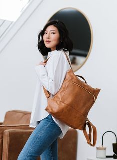 The Reese Backpack comes in two sizes (standard and oversized) to fit all you'll need to carry on the go, without looking like you're about to check your luggage. Toss in any size laptop, books, keys, wallet, and even an extra pair of shoes... without looking like you're about to go on a 12-mile hike! Each gorgeous neutral color comes in ultra-soft and durable vegan leather. The Reese features adjustable backpack straps and a top handle for a quick grab. It has two exterior pockets (one front an Large Capacity Laptop Backpack For On-the-go, Versatile Backpack Laptop Bag For On-the-go, Large Capacity Tote Backpack For On-the-go, Leather Backpack With Large Capacity For On-the-go, Laptop Backpack With Adjustable Strap For On-the-go, Standard Backpack For Daily Use, Standard Backpack With Luggage Sleeve For Daily Use, Versatile Rectangular Backpack For On-the-go, Everyday Travel Backpack