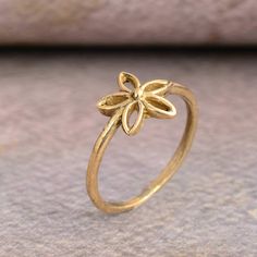 Gold flower ring, dainty ring, birthday gifts, floral ring, gift for her, minimalist ring, stackable ring, engagement ring, promise ring.  ♥ DETAILS ♥ *Materials: Brass *Size: All sizes are available. ♥ DELIVERY ♥ *IMPORTANT: Before placing an order, please double check your delivery address is correct and complete to avoid delays and lost packages. *You can return your purchased item within 15 days after successful delivery. *We offer a 100% "Money Back Guarantee" if you are not satisfied with Dainty Stackable Rings As Gift, Dainty Stackable Rings Gift, Dainty Midi Rings For Gifts, Dainty Gold Flower Stackable Rings, Delicate Gold Flower Stackable Rings, Delicate Toe Ring Jewelry For Gifts, Dainty Tiny Midi Rings As Gift, Tiny Elegant Flower Ring For Weddings, Delicate Gold Flower Ring