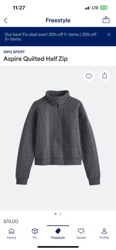 an image of a gray sweater with zips on it