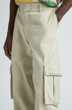 Rhuigi Villaseñor continues to elevate traditional streetwear with all-cotton cargo pants refreshed in the baggy fit seen all over the 2024 runways. Uniquely shaped pocket flaps further the statement-making aesthetic. Zip fly with hook-and-bar closure Front slant pockets; back patch pockets; cargo bellows pockets Lined 100% cotton Dry clean Made in the USA Designer Clothing Utility Style Cotton Cargo Jeans, Full Length, Relaxed Fit Utility Cargo Pants With Patch Pockets, Baggy Khaki Cotton Cargo Jeans, Urban Pants With Pockets And Straight Hem, Full Length Khaki Cotton Cargo Jeans, Relaxed Fit Full-length Cargo Pants With Patch Pockets, Spring Cotton Cargo Jeans For Elevated Casual, Elevated Casual Cotton Cargo Jeans For Spring, Urban Cotton Cargo Jeans