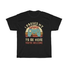 I Paused My Game To Be Here You're Welcome Shirt, Gamer Shirt, Funny Gaming T-shirt, Men's Women Kids, Gamer Gift, Gaming Present. Great present for the gamer in your life for any occasion and for any age.  Perfect gift for the video game enthusiast, gamer, retro gamer, console gamer, pc gamer, and everyone in between. This heavy cotton tee has the classic cotton look and feel. Casual elegance will make it an instant favorite in everyone's wardrobe. .: Classic fit .: 100% Cotton (fibre content may vary for different colors) .: Light fabric (5.3 oz/yd² (180 g/m .: Tear away label .: Runs true to size Rude T Shirts, Horror Movie Shirts, Funny Gaming, Gamer Shirt, Gamer T Shirt, Retro Gamer, Movie Shirts, Jan 1, You're Welcome