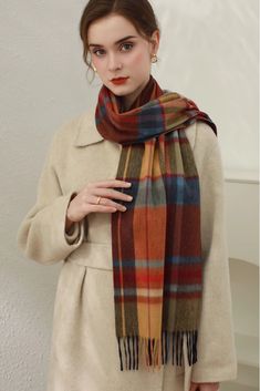 Cashmere Elegance in Classic Plaid Add a touch of luxury and style to your winter ensemble with our Christmas Plaid Cashmere Fringe Scarf. Made from plush cashmere, this scarf offers exceptional warmth without the bulk. The classic Scottish plaid design makes it a versatile piece for any outfit. Measuring 180cm x 30cm, it can be worn as a scarf or shawl for added convenience. Style #: WKAI510 Elegant Red Scarf For Fall, Classic Red Scarves For Winter, Elegant Multicolor Scarves For Fall, Elegant Red Scarves For Winter, Elegant Red Scarf For Winter, Elegant Red Winter Scarf, Red Wool Winter Scarves, Red Wool Scarves For Winter, Formal Wool Scarves For Winter