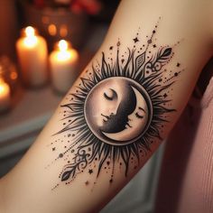 a woman's arm with a sun and moon tattoo design on the left forearm