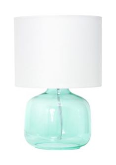 a green glass table lamp with a white shade on the top, and a light blue base