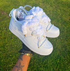 This is a white AF1 with gold accents, fluffy shoelaces and the OW cross lace. Luxury White Custom Sneakers With Elastic Laces, White Sneakers With Round Toe And Lacing, White Sneakers With Lacing And Round Toe, White Round Toe Sneakers With Lacing, Designer Crocs, Shoe References, White Af1, Casual Shoes Women Sneakers, Fluffy Shoes