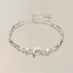 Description: Material: alloy Size:onesize Color:as picture 1. A bow symbolizes love, sweetness, and romance, while also conveying a feminine softness and elegance. 2. This bracelet features a slender chain with a cherry blossom shaped pendant embedded in the middle, which not only serves as decoration but also enhances the overall visual appeal of the bracelet. 3. Suitable for daily casual attire, it can also add a touch of warmth and romance in special occasions such as dates, parties, celebrat Feminine Softness, Blossom Bracelet, Crystal Flowers, Spring Clothing, Bow Bracelet, Dangle Hoop Earrings, Moon Pendant Necklace, Pink Dresses, Pretty Bracelets