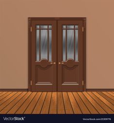 an empty room with two brown doors and wooden flooring in front of the door