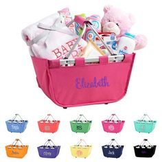 a pink basket filled with baby items and personalized gifts for the child's first birthday