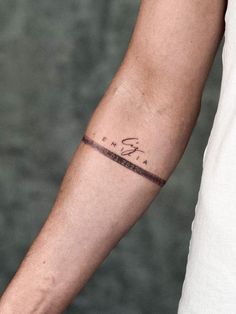 a man's arm with a tattoo on it and the word faith written in cursive writing