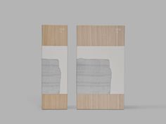 two pieces of wood with white and grey paint on them, one is in the shape of a rectangle