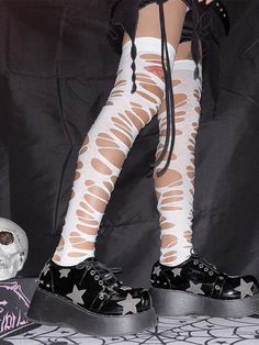 Elevate your punk fashion game with our striking black/white cut-out design punk stockings. These eye-catching stockings feature a bold cut-out pattern that seamlessly blends rebellion with style. Punk Style Leg Warmers For Cosplay, White Thigh High Tights For Cosplay, Black Punk Stockings For Alternative Fashion, Punk Style Thigh High Stockings For Cosplay, Halloween Punk Thigh-high Stockings, Punk Thigh High Halloween Stockings, Halloween Punk Thigh High Stockings, Punk Style Stretch Legwear For Cosplay, Trendy Thigh High Stockings For Cosplay