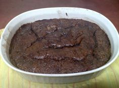 a white bowl filled with brownies on top of a table