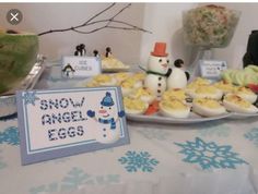 a table topped with lots of food and decorations