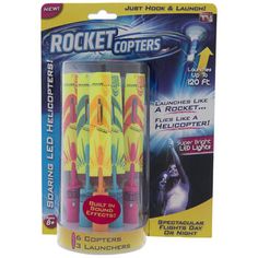 three different colored rockets are in the package