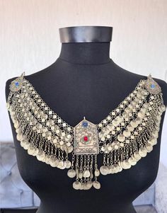 This is a unique antique Ottoman period fez necklace with Ottoman jewelry. It is a beautiful representation of Ottoman jewelry. The necklace is made of low-carat silver, and is an original piece made before 1920. Its originality makes it a valuable addition to any collection. , This necklace is perfect for those interested in Ottoman clothing and jewelry. You can use it in different designs The items I sell are not new, they are vintage or antique, of course it goes without saying that there may Ceremonial Medallion Jewelry With Historical Design, Traditional Medallion Jewelry With Historical Design, Ceremonial Historical Pendant Jewelry, Ceremonial Historical Design Pendant Jewelry, Traditional Medallion Jewelry For Ceremonial Occasions, Bohemian Long Necklace For Ceremonial Occasions, Bohemian Long Necklace For Ceremonies, Bohemian Long Temple Necklace For Wedding, Traditional Metal Pendant Necklaces