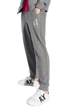 Dimensional Armani Exchange embroidery tops one leg of sweatpants knit from soft, breathable cotton in a fit that stays close for easy-moving comfort. Elastic waist with internal drawcord Front welt pockets; back welt pocket Banded cuffs 100% cotton Imported Men's Clothing Logo Waistband Athleisure Sweatpants, Athleisure Sweatpants With Logo Waistband, Cozy Fit Jogging Bottoms With Ribbed Cuffs, Comfort Waistband Fleece Bottoms For Loungewear, Fleece Bottoms With Comfort Waistband For Loungewear, Casual Streetwear Sweatpants With Logo Waistband, Casual Sweatpants With Logo Waistband For Streetwear, Gray Activewear With Ribbed Cuffs For Loungewear, Relaxed Fit Cotton Bottoms With Logo Waistband